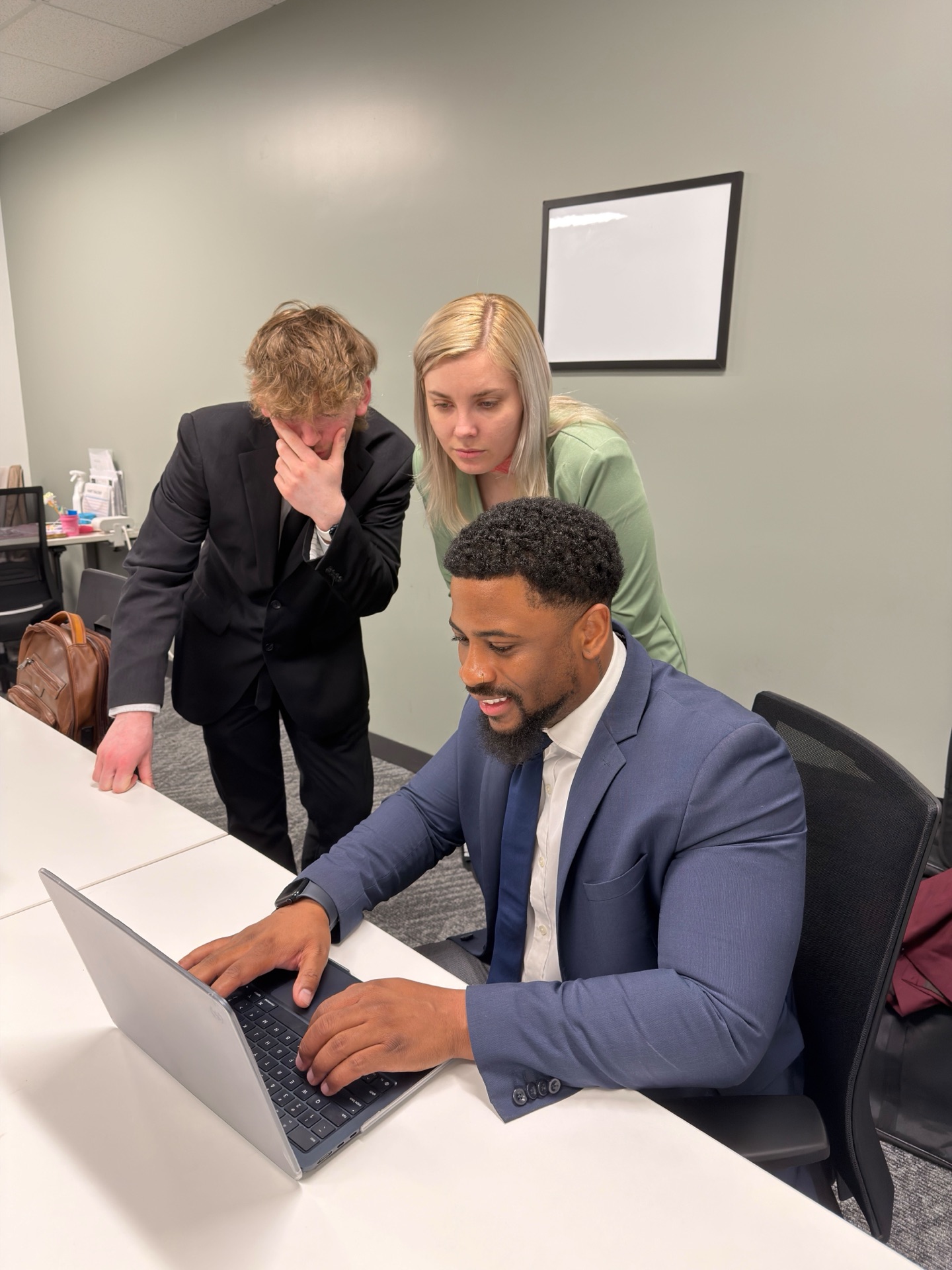 Essential Solutions Marketing team collaborating on strategy in the Sacramento office